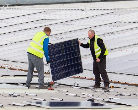 Solar panels being installed on Glasdon Warehouse